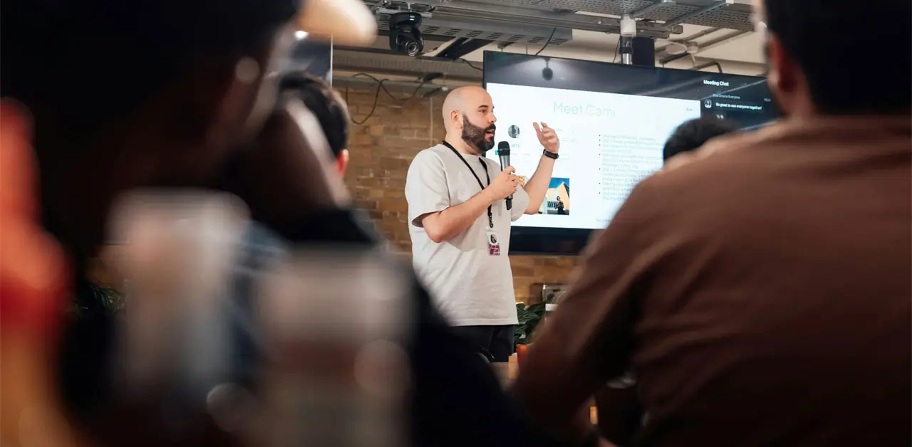 A Man Delivers A Presentation To A Captivated Audience, Sharing Insights And Information A Man Delivers A Presentation To A Captivated Audience, Sharing Insights And Information