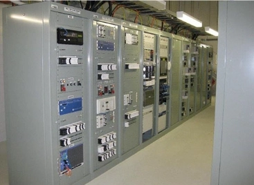 Electrical control room featuring multiple panels and equipment for monitoring and managing electrical systems